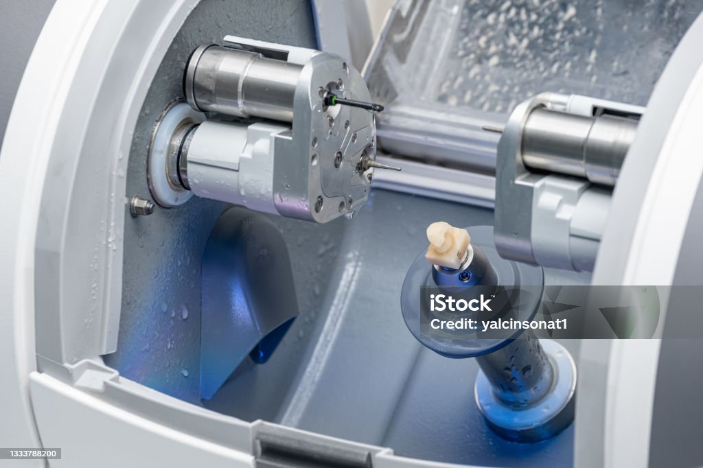 CAD CAM dental computer-aided machine. Digital modern dental laboratory for prosthesis and crowns milling